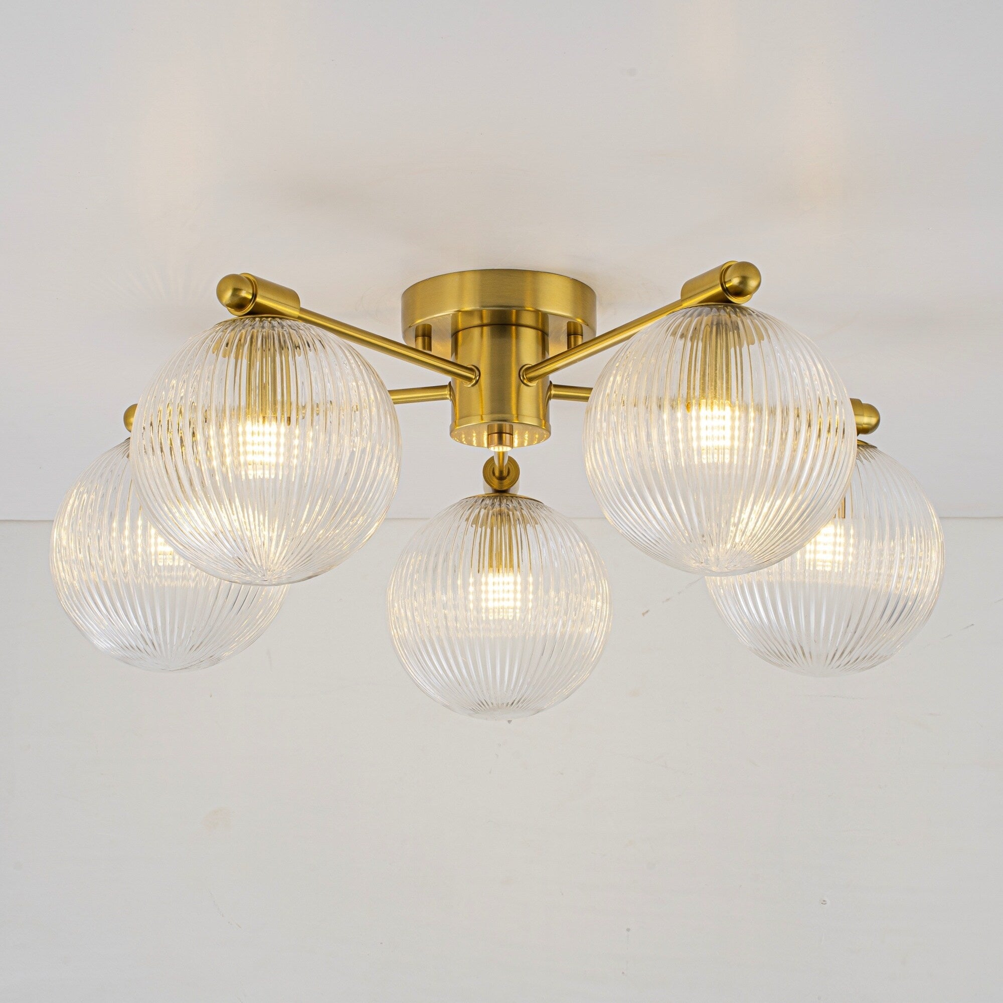 22 In. 5 Light Modern Brass Clear Ribbed Glass Globe Semi Flush Mount Ceiling Light 22.05 In. Diameter X 8.66 In. Height