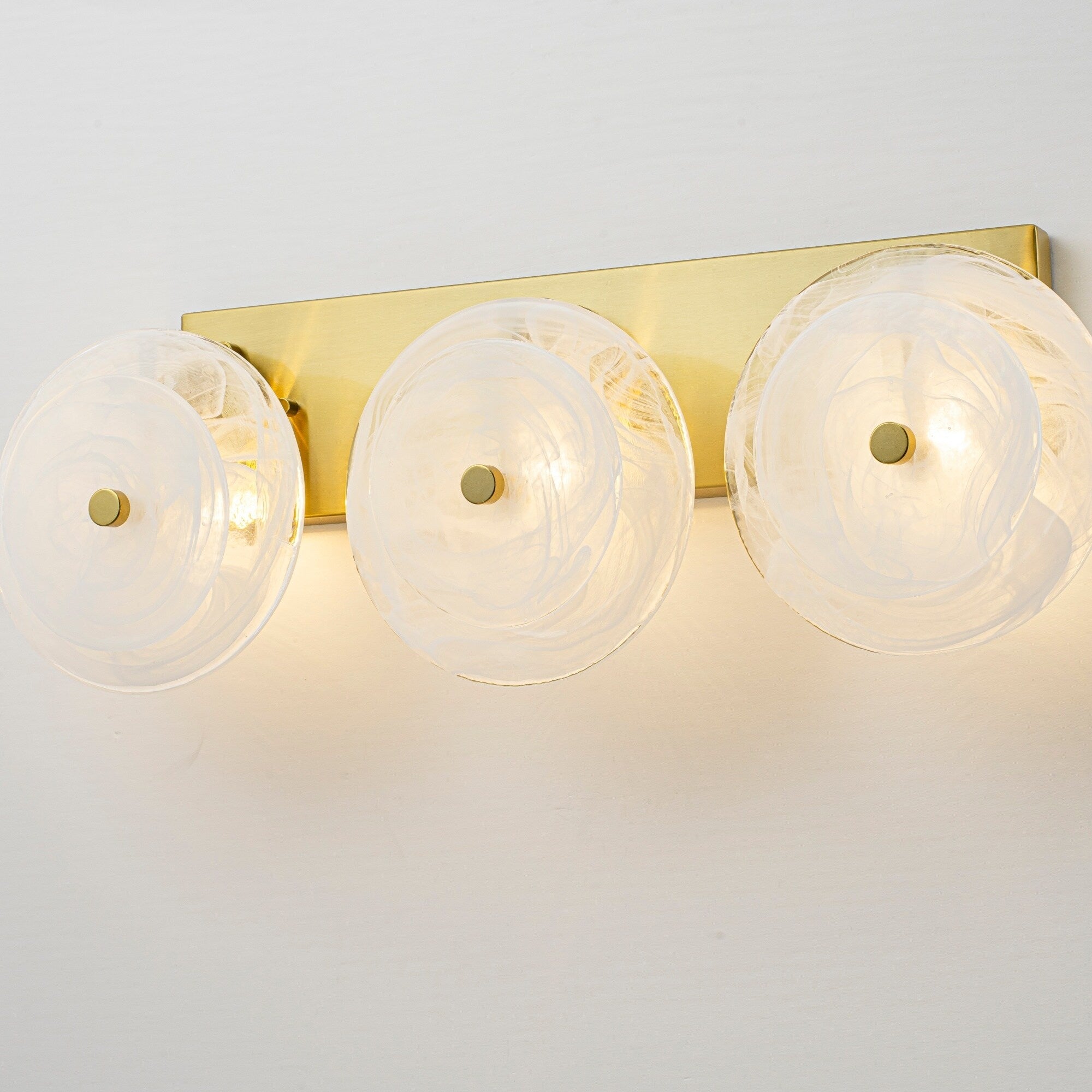 3 Light Mid Century Modern Brushed Brass Vanity Light With Cloud Textured Round Glass Glass Disc