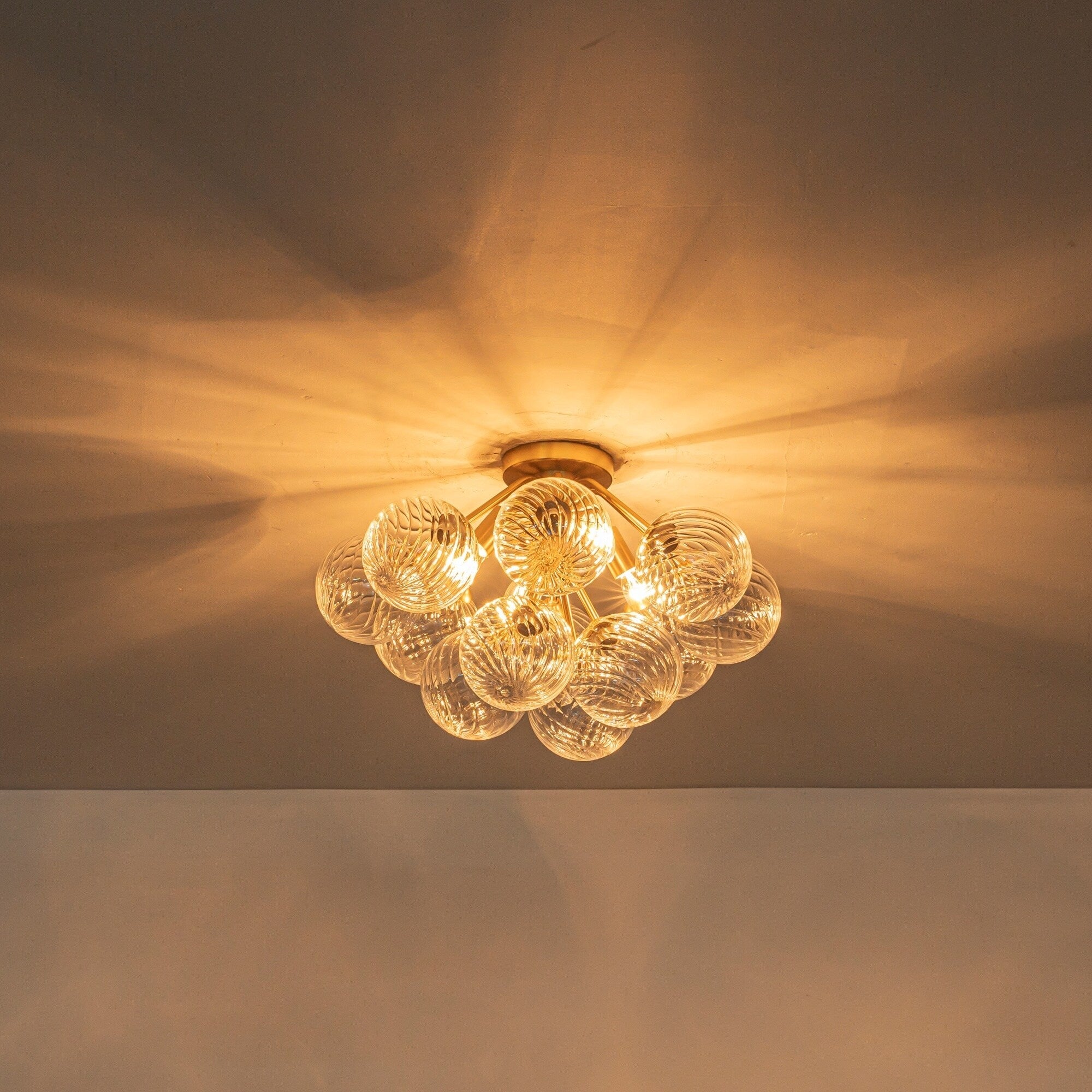 4 Light Modern Luxury Brushed Brass Iron Textured Glass Globe Flush Mount Ceiling Lighting For Living Dining Areas