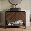 A Bathroom Vanity With A Sink Featuring Two Louvered Doors And An Oval Basin 35.83