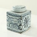 Approx.8 Inches Subtle Blue And White Square Jar With Floral Motif