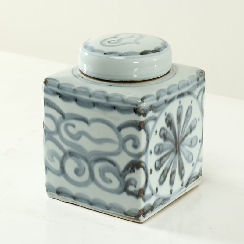 Approx.8 Inches Subtle Blue And White Square Jar With Floral Motif