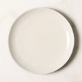Barchan 4-Piece Black and Warm White Stoneware Dinnerware Set by Kravitz Design