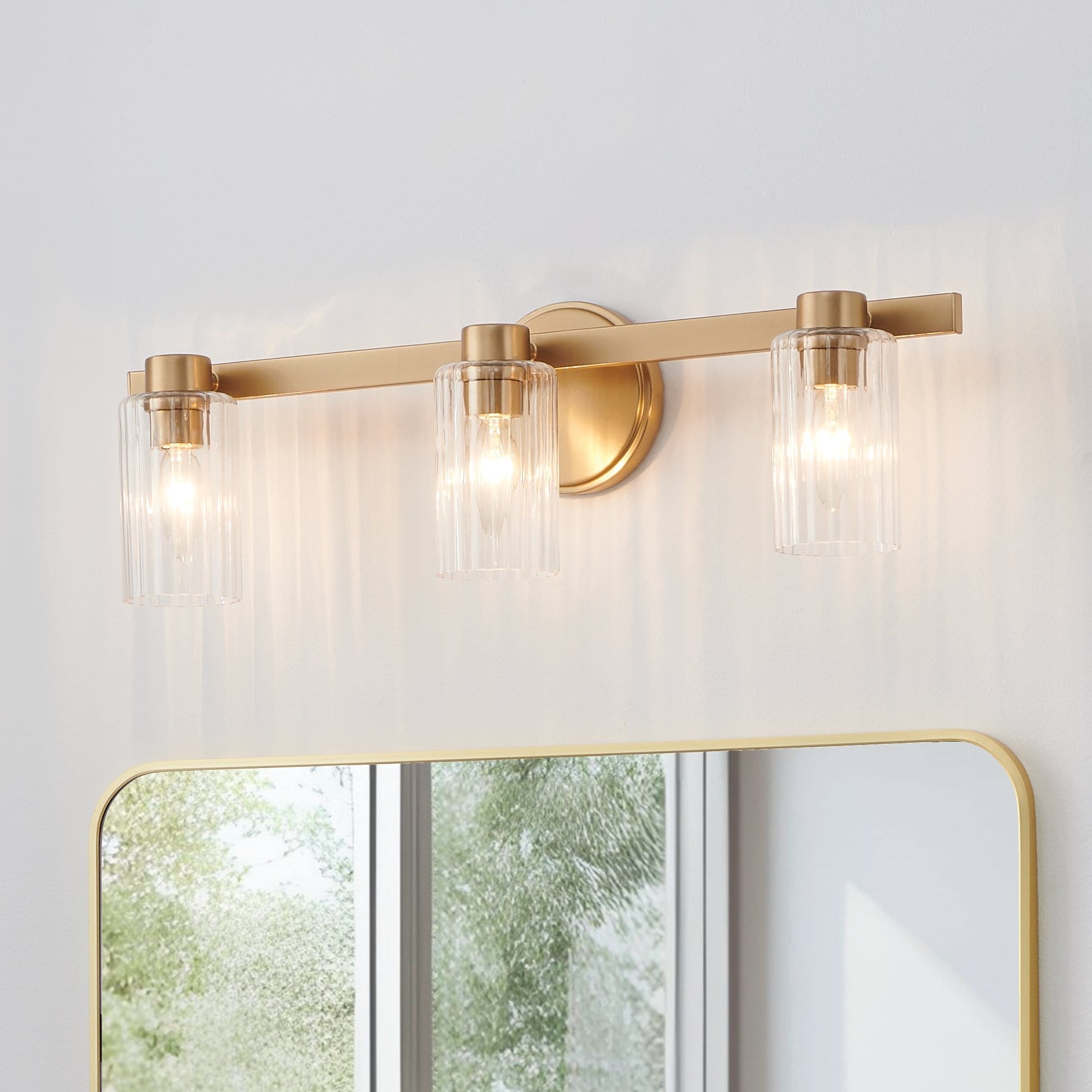 Bedminster 24 Inch 3 Light Champagne Gold Vanity Light With Clear Ribbed Glass Shades