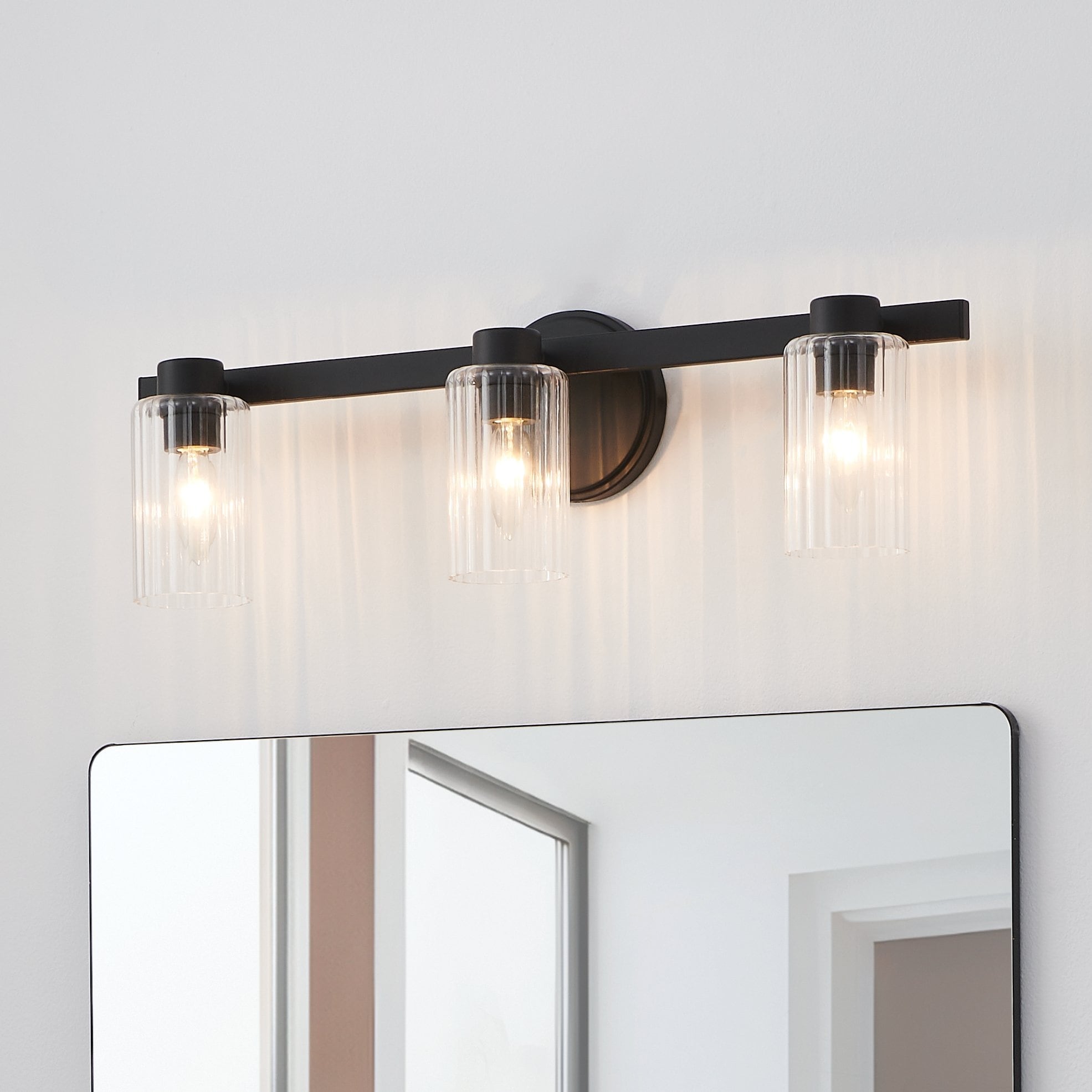 Bedminster 24 Inch 3 Light Matte Black Vanity Light With Clear Ribbed Glass Shades