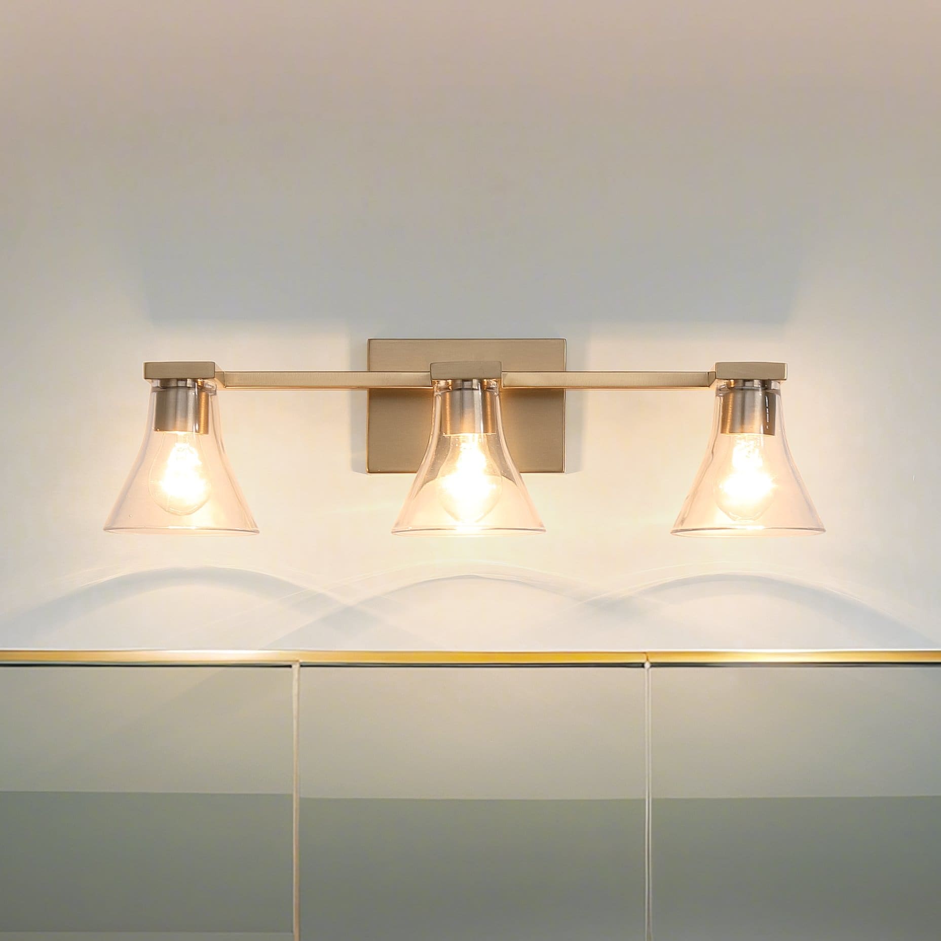 Gilford 24 Inch 3 Light Champagne Gold Vanity Light With Clear Glass Shades