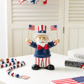Glitzhome 9 H Patriotic Americana Polyresin Santa Holding Flags Table Decor
