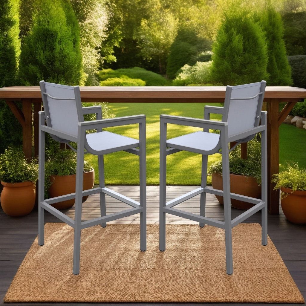 Armen Living Marina Outdoor Patio Barstool In Grey Powder Coated Finish With Grey Sling Textilene And Grey Wood Accent Arms
