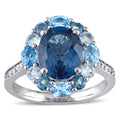Miadora Sterling Silver Oval Cut Blue And White Topaz Halo Cocktail Ring