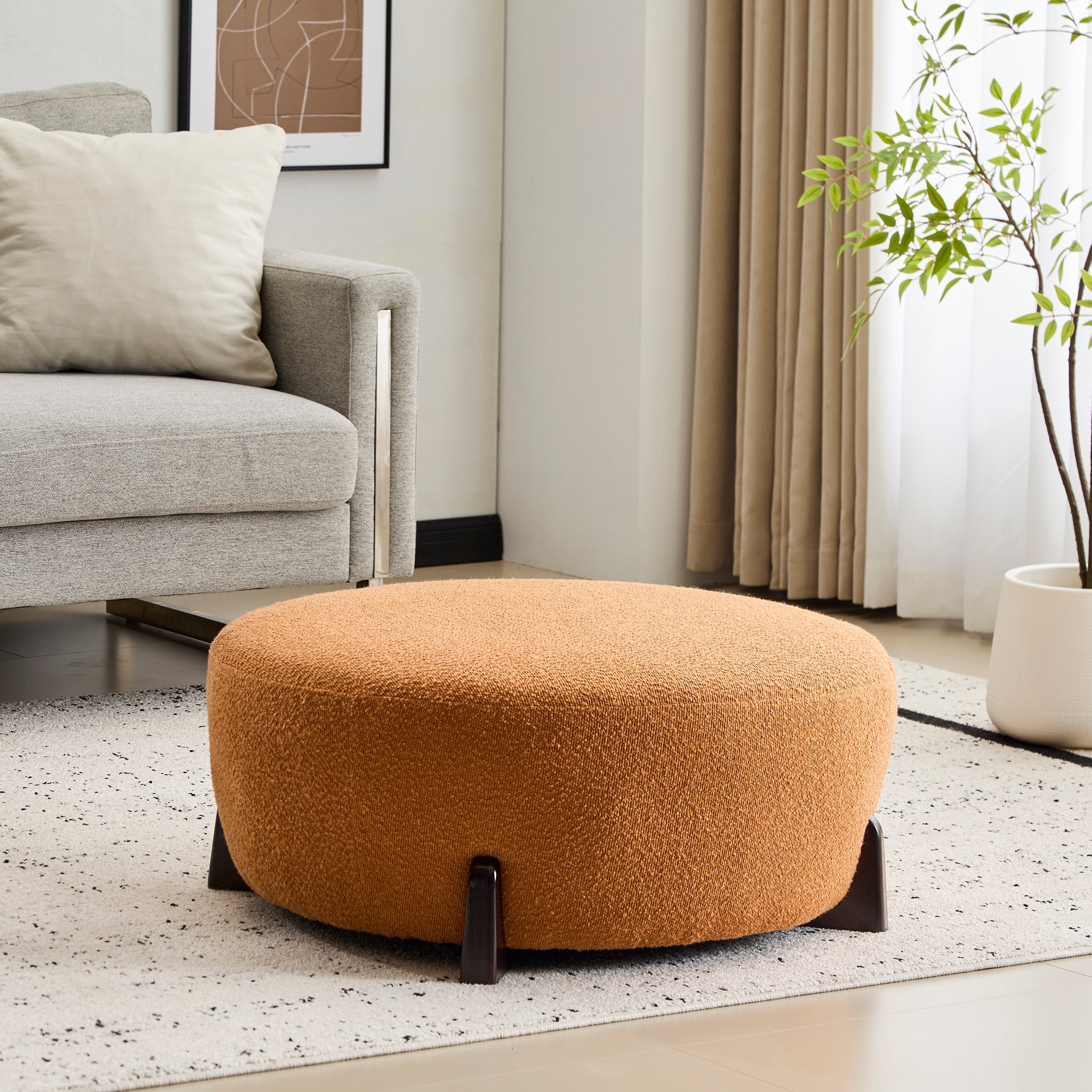 Modish Round Ottoman Boucle Top With Splayed Rubber Wood Legs Pumpkin Orange