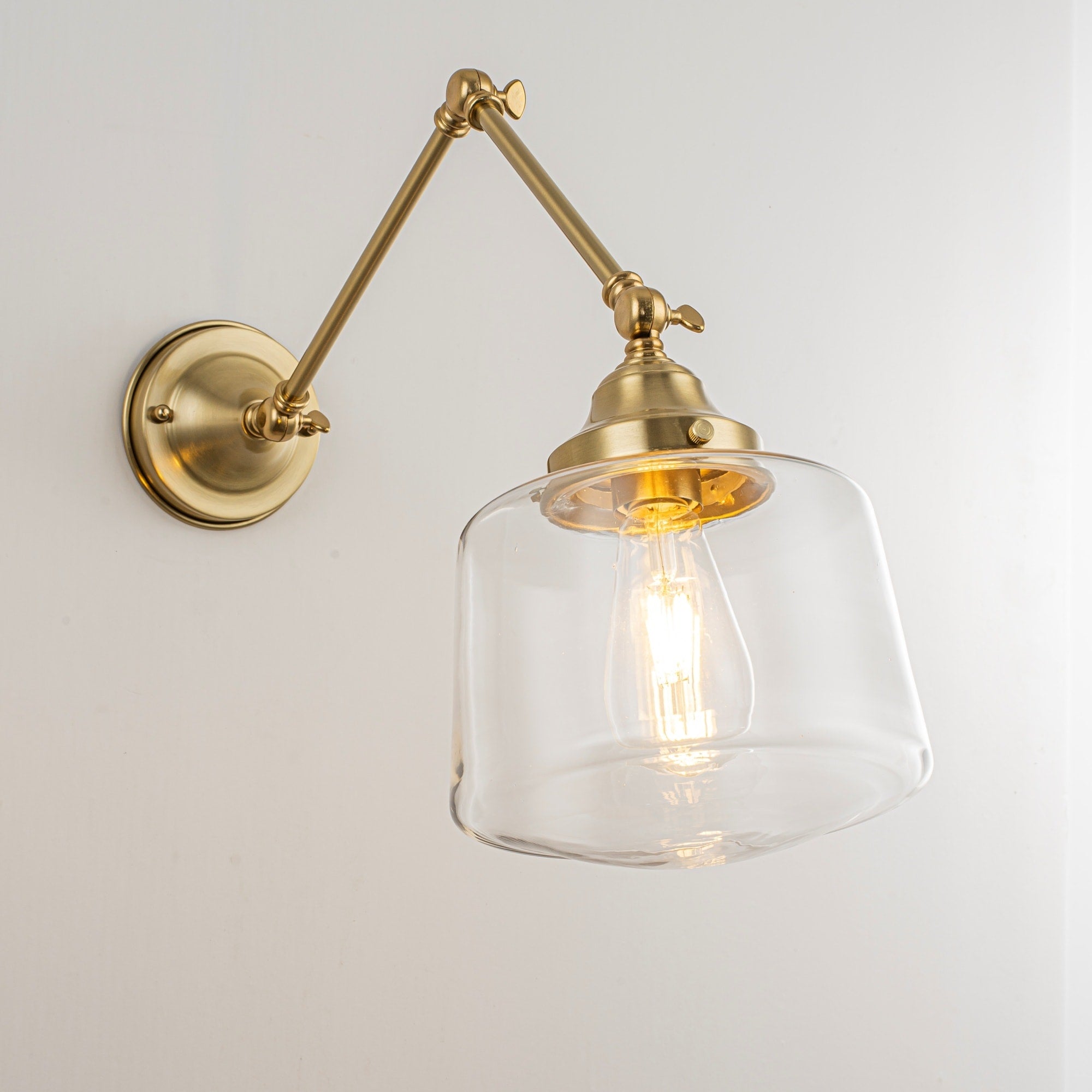 Rennnsan 1 Light Modern Gold Adjustable Swing Arm Wall Sconce With Clear Glass Shade And Brass Finish
