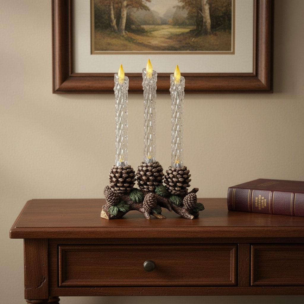 Set Of Three Clear Flameless Taper Candles In Brown And Green Resin Pinecone Holder