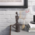 Woman In Reflection Cast Iron Sculpture